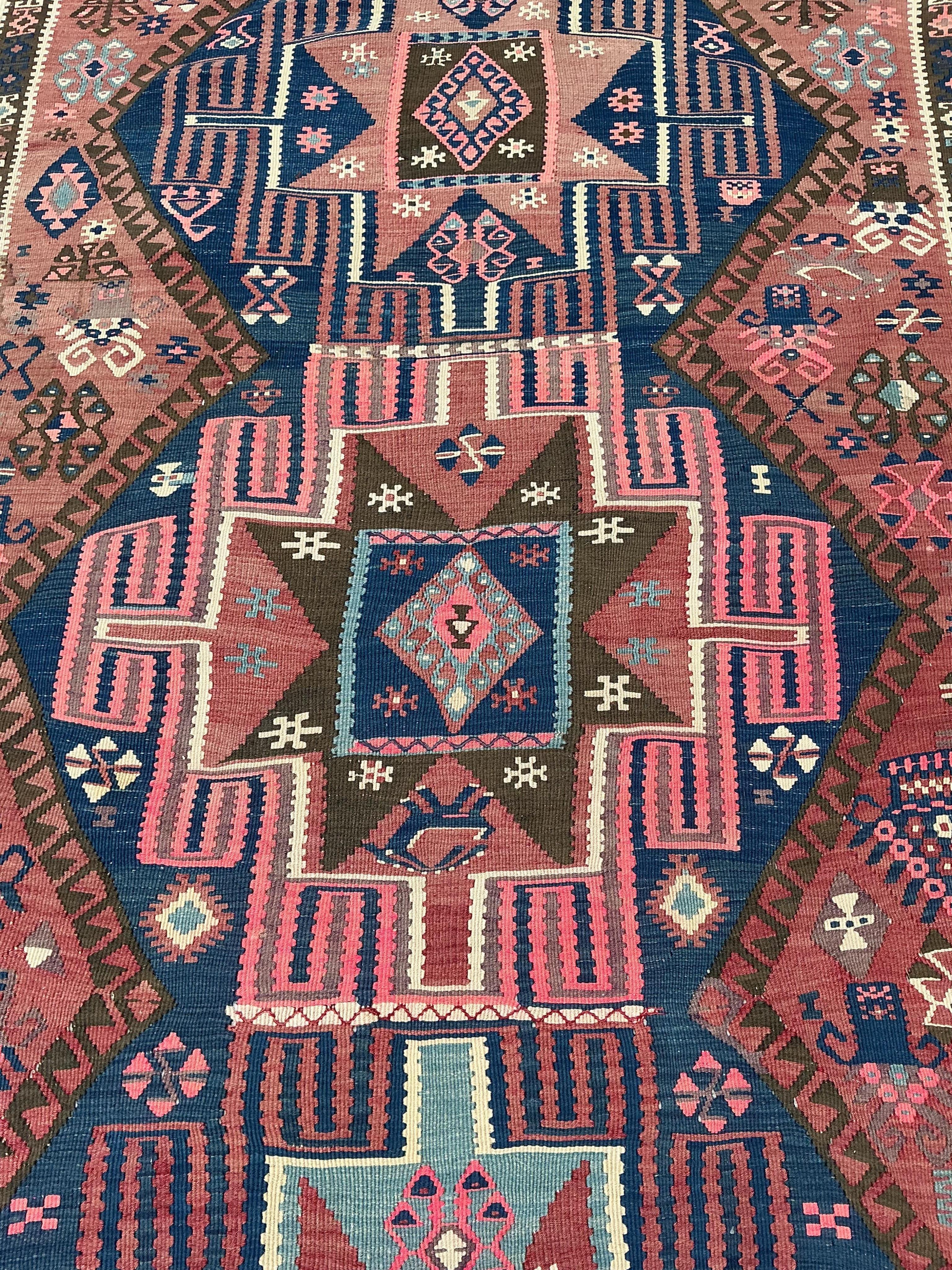 An early 20th century Turkish red ground flat weave Kilim runner, 430 x 138cm